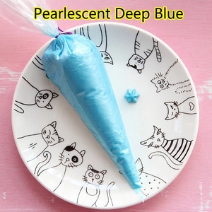 Detailed view of 100g pearlescent dark blue cream glue paste in a piping bag for DIY craft