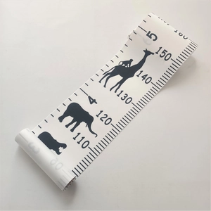 Detail of rolled 3D wall height chart featuring animal silhouettes for kids room decor