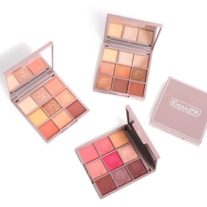 Macro view of four 9-color eyeshadow palettes showing glitter and matte powder textures
