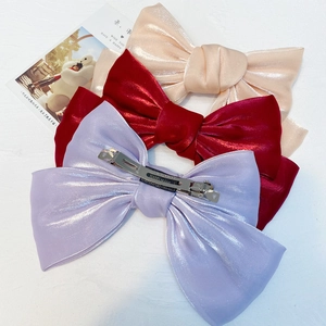 Detailed set of three organza bow clips in gold, burgundy and purple with spring clasps