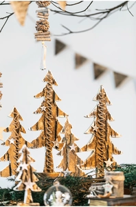Detail of natural birch bark Christmas trees with hemp rope and wooden star toppers