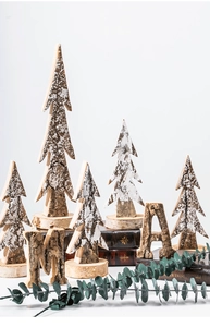 Natural birch wood Christmas tree decor with snow effect on vintage book stand