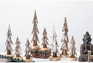 Macro detail of natural wood textures and bark finishes on minimalist tabletop Christmas trees