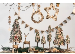Detail of natural wood and birch bark Christmas tree ornaments in rustic country style