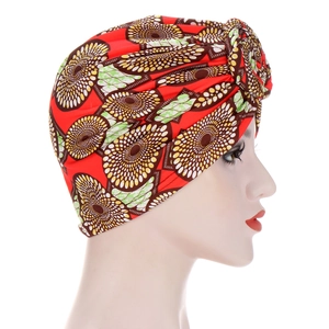 Ethnic turban cap with red base and geometric floral print featuring cross knot design