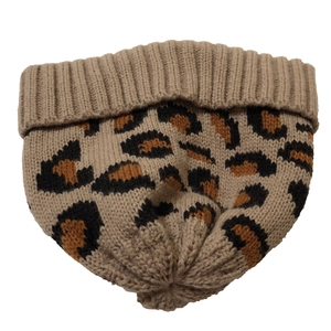 Detailed close-up showing khaki leopard print knit pattern and ribbed cuff texture