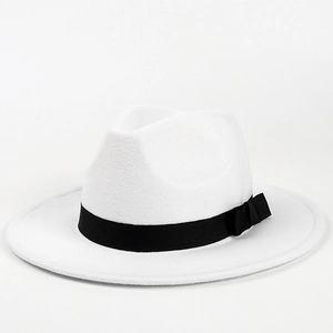 Close-up of white wool fedora crown with black ribbon band and elegant side bow