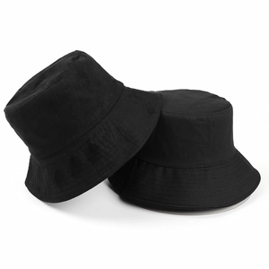 Detail of black double-sided suede bucket hat showing reinforced brim stitching and fabric