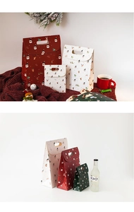 Close-up of assorted festive Christmas paper gift bags in red, white and green colors