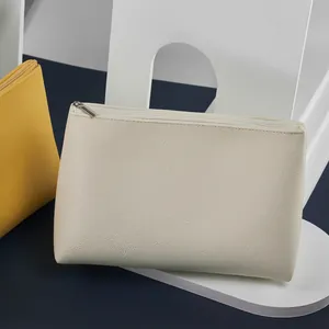 Neceser de maquillaje minimalista de cuero impermeable de gran capacidad en blanco y amarillo