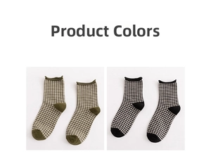 Detail of vintage plaid crew socks in green and black with ruffle cuffs on white background