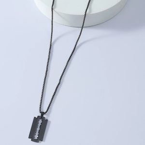 Detailed view of a sleek black stainless steel razor blade pendant with minimalist chain