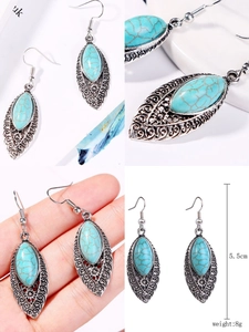 Detailed view of bohemian turquoise earrings with silver woven design, 5.5cm length