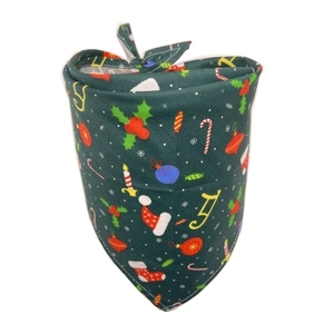 Close-up of dark green cotton Christmas dog bandana with festive candy cane and sock patterns