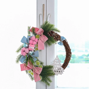 Lush Christmas wreath with pink and blue bows, pine cones, and ornaments on a white window
