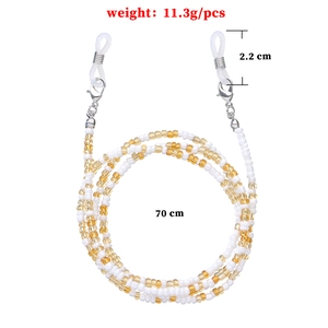 Beaded eyewear chain with white and amber beads, 70cm long with silver lobster clasps