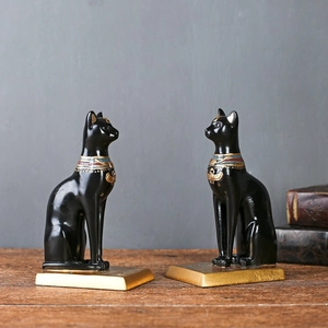 Vintage Egyptische Bastet kat boekensteunen van zwarte hars met gouden details voor decor