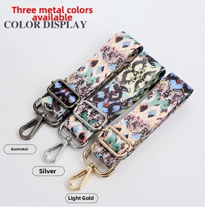 Detail of adjustable ethnic woven bag straps with gunmetal, silver, and gold swivel hooks