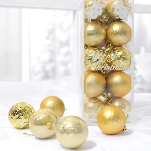 24-piece set of 4cm gold Christmas baubles with glitter and matte finishes on white fabric