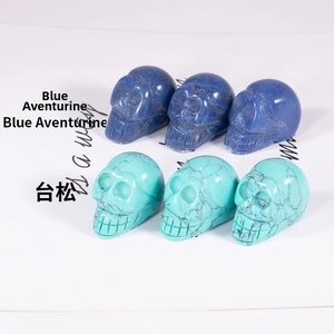 Detailed hand-carved skull carvings in blue aventurine and turquoise natural stones
