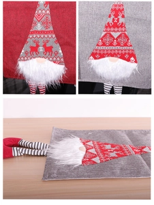 Detail of Christmas gnome burlap table runner with striped legs and knit fabric textures