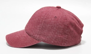 Side view of washed burgundy cotton baseball cap with vintage distressed texture