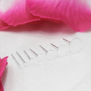 Macro shot of S925 sterling silver earring posts with various flat pad diameters