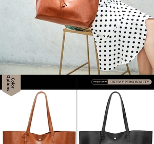 Detail view of brown and black oil wax leather bucket bags with elongated shoulder straps