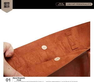 Detailed macro view of the vintage metal magnetic buckle and soft suede interior of the bag