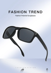 Detail of matte black sports sunglasses with polarized lenses and silver metal accents