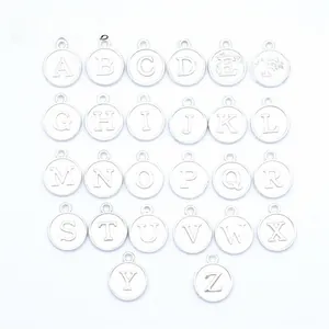 Macro view of 26 pieces silver alphabet charms for DIY jewelry making accessories