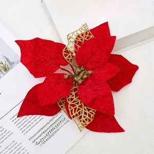 Red velvet poinsettia Christmas flower with gold glitter and hollow leaf decor