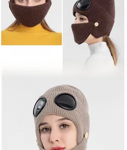 Detail of winter knit aviator hat featuring built-in goggles and integrated face mask