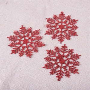 Three red glitter snowflake ornaments set for Christmas tree decoration with hanging holes