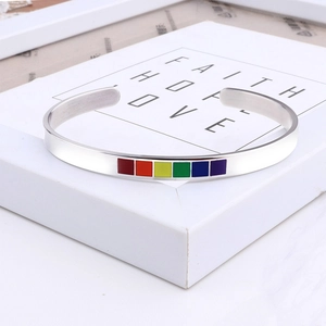 Detailed macro shot of 6mm stainless steel C-shape cuff with rainbow enamel segments
