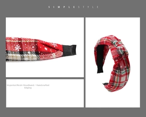 Detail view of red and white plaid Christmas headband with snowflake pattern knot design