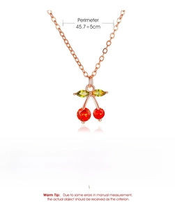 Detailed view of cherry pendant necklace with size specs and copper material info