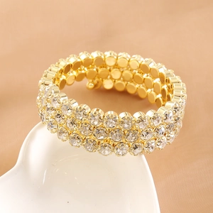 Three-row rhinestone elastic bracelet in gold finish on a heart-shaped plate
