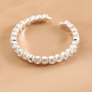 Detailed view of silver crystal elastic bracelet with shimmering rhinestones for wedding