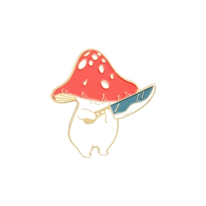 Vue détaillée du pin's en émail champignon avec chapeau rouge et couteau bleu