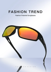Détail de lunettes de sport polarisées avec verres dégradés orange et monture noire mate