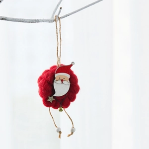 Handmade wool felt Santa Claus ornament hanging on a branch with white wooden beads