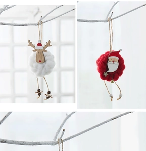 Detail of wool felt Santa and reindeer Christmas tree ornaments with wooden base