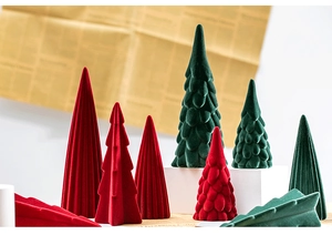 Detailed view of red and dark green flocked Christmas trees with velvet vertical textures