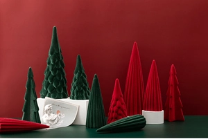 Detail of red and dark green flocked ceramic Christmas trees with velvet texture