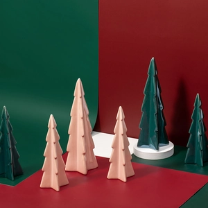 Ceramic Christmas tree ornaments in green and pink with a glossy finish for festive decor