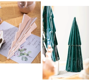 Close-up of ribbed ceramic Christmas tree ornaments in polished pink and green glazes