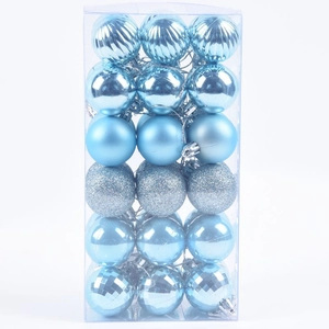 Detail of 36pcs blue Christmas balls with matte, glitter, and glossy textures in a box