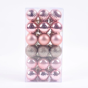 Pink Christmas ball ornaments set with glitter and matte finishes in a clear PVC box