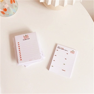 Cute cherry-themed stationery set with To Do List and weekly planner sheets on a white desk